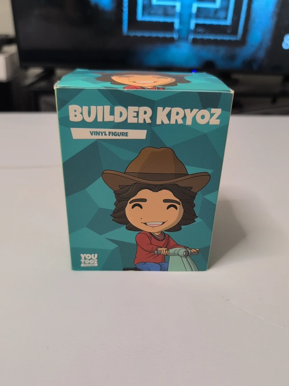 Builder Kryoz Vinyl Figure - Teal and Brown Collectible Toy